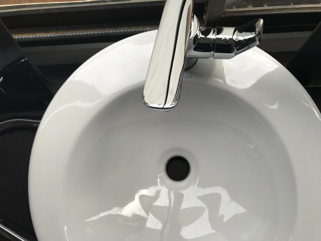 white bathroom sink with faucet
