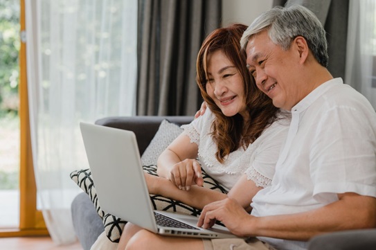 an elderly couple doing a video call