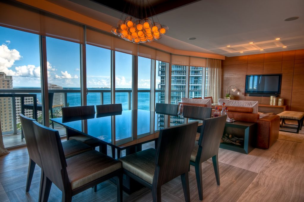 Inside view of a modern apartment with view to the bay.