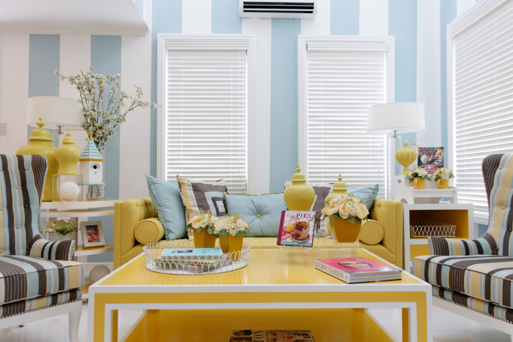 living area with light blue wallpaper